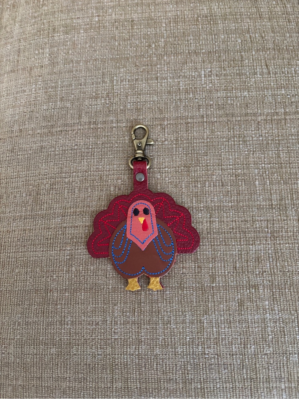 Portland Leather Goods “Virgil” farm animal purse flair keychain.